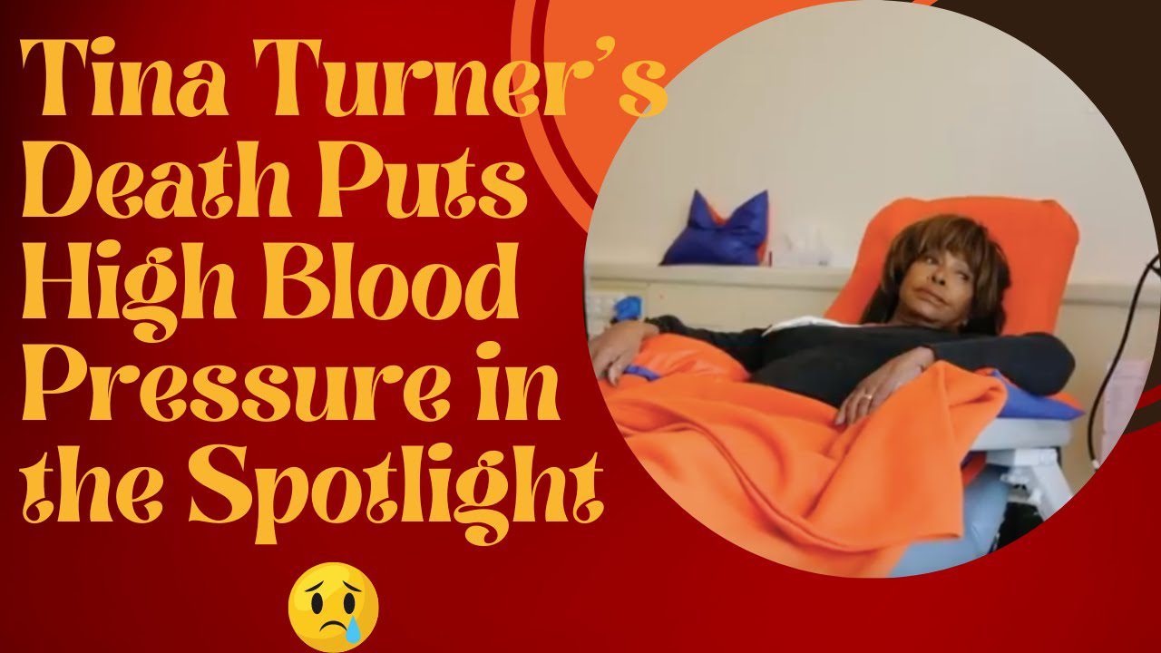 A person laying in bed with an orange blanket.