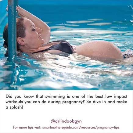 A pregnant woman swimming in the water.